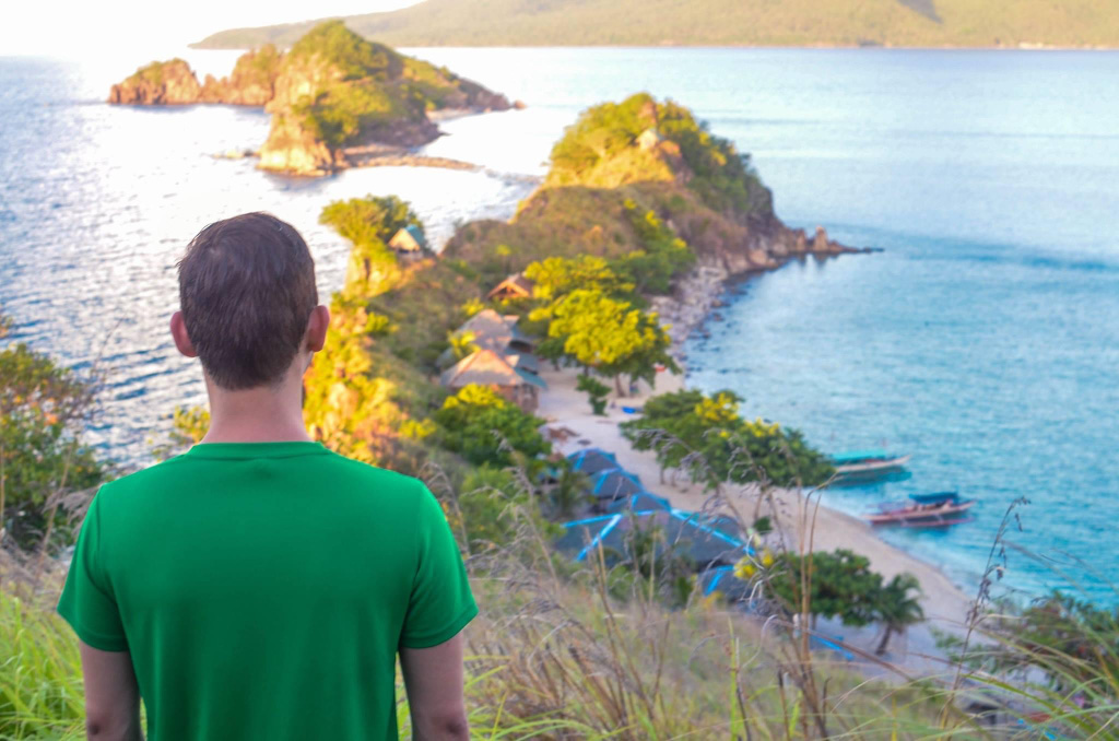 man looking out to the ocean in Sambawan Island