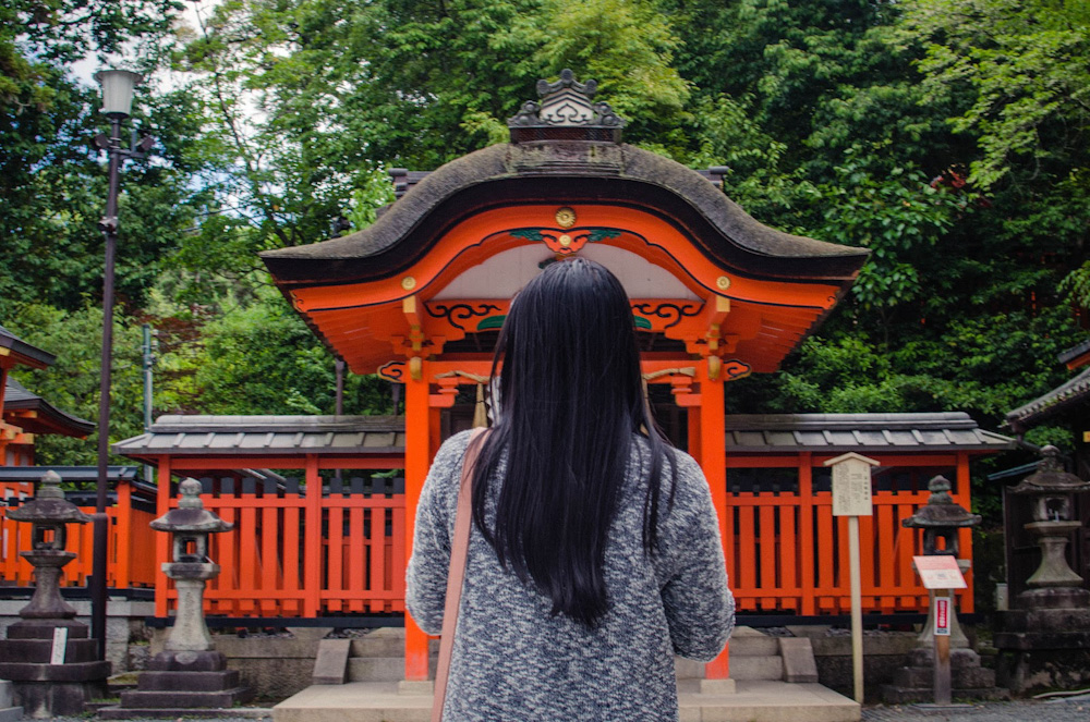 woman in front of a shrine