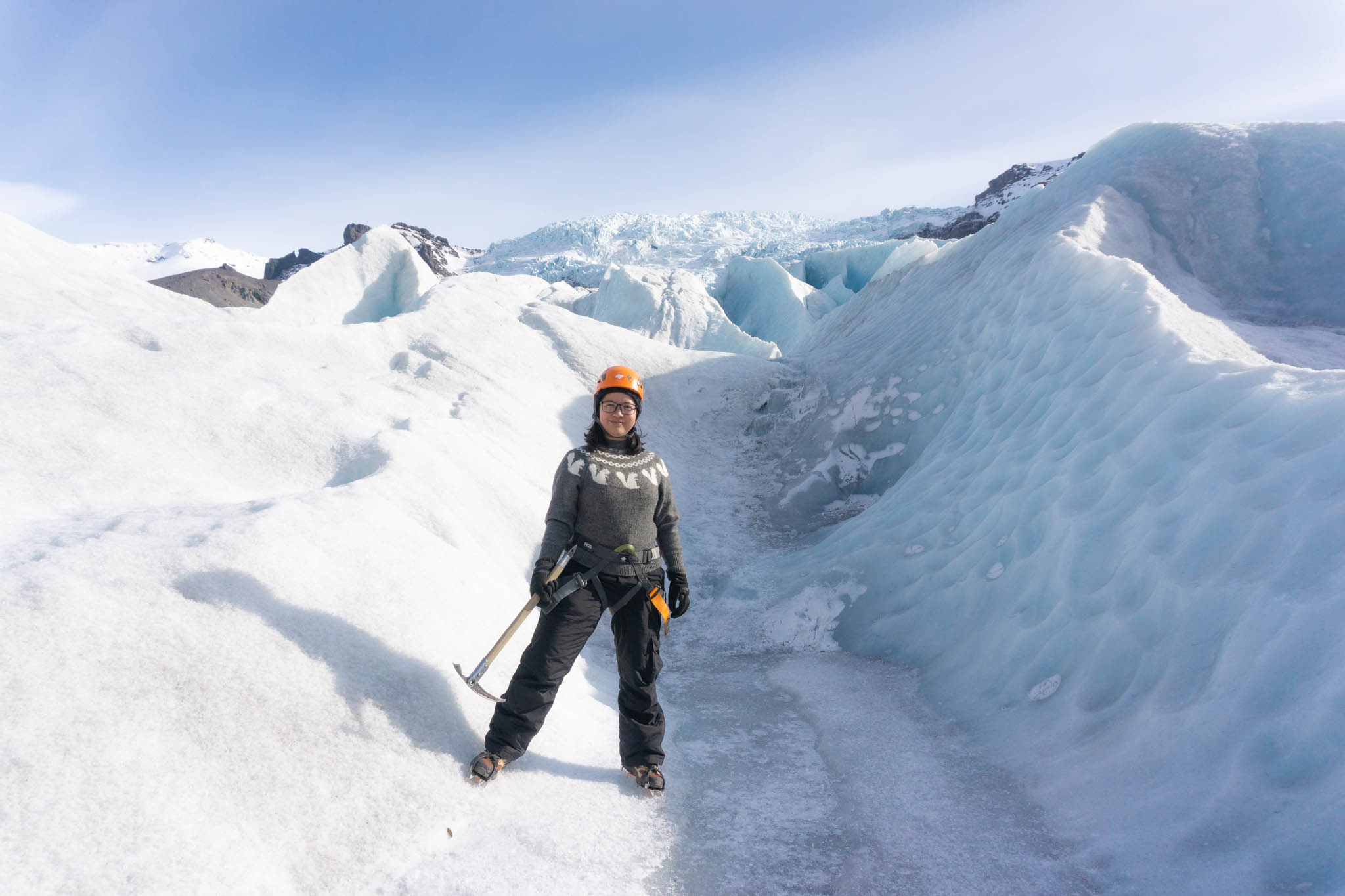 woman standing on a glacier in Iceland